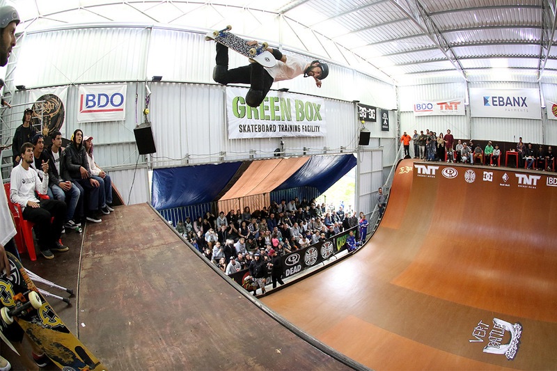 Skater airborne on a JBSR vert ramp during a contest